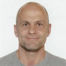 A person in a gray shirt

Description automatically generated