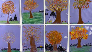 Autumn Leaves Paintings of fall trees, four on top and four underneath. All have a blue background with green grass in the foreground.