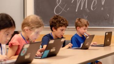 Students coding on the computer