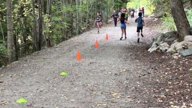 student running on the trail