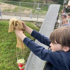 Student dropping their egg drop contraption